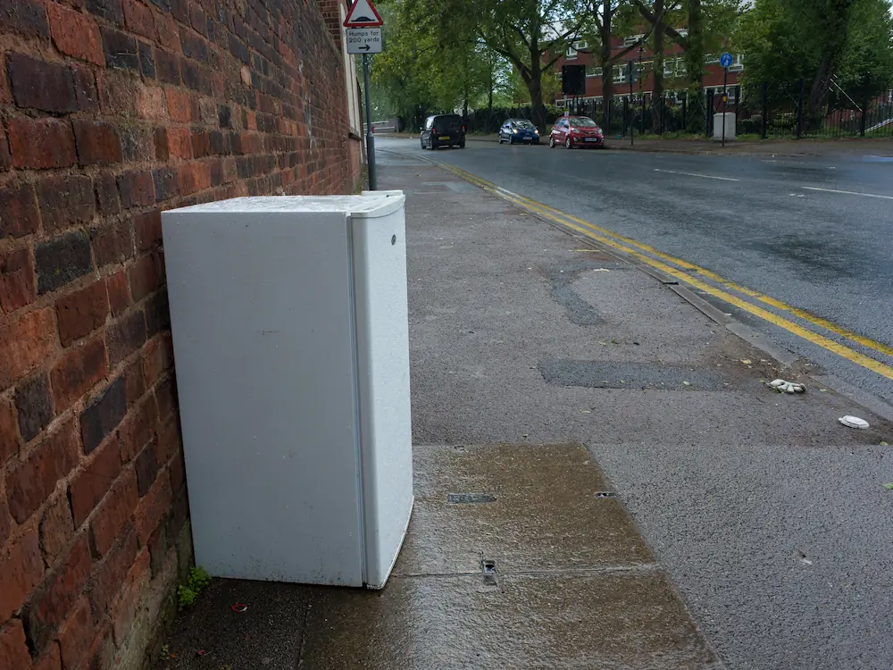 A big sofa leave upside down in street