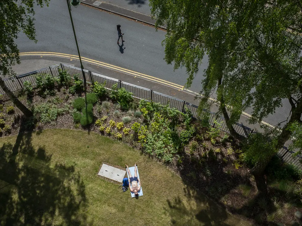 A shopping trolly is falling in the canal