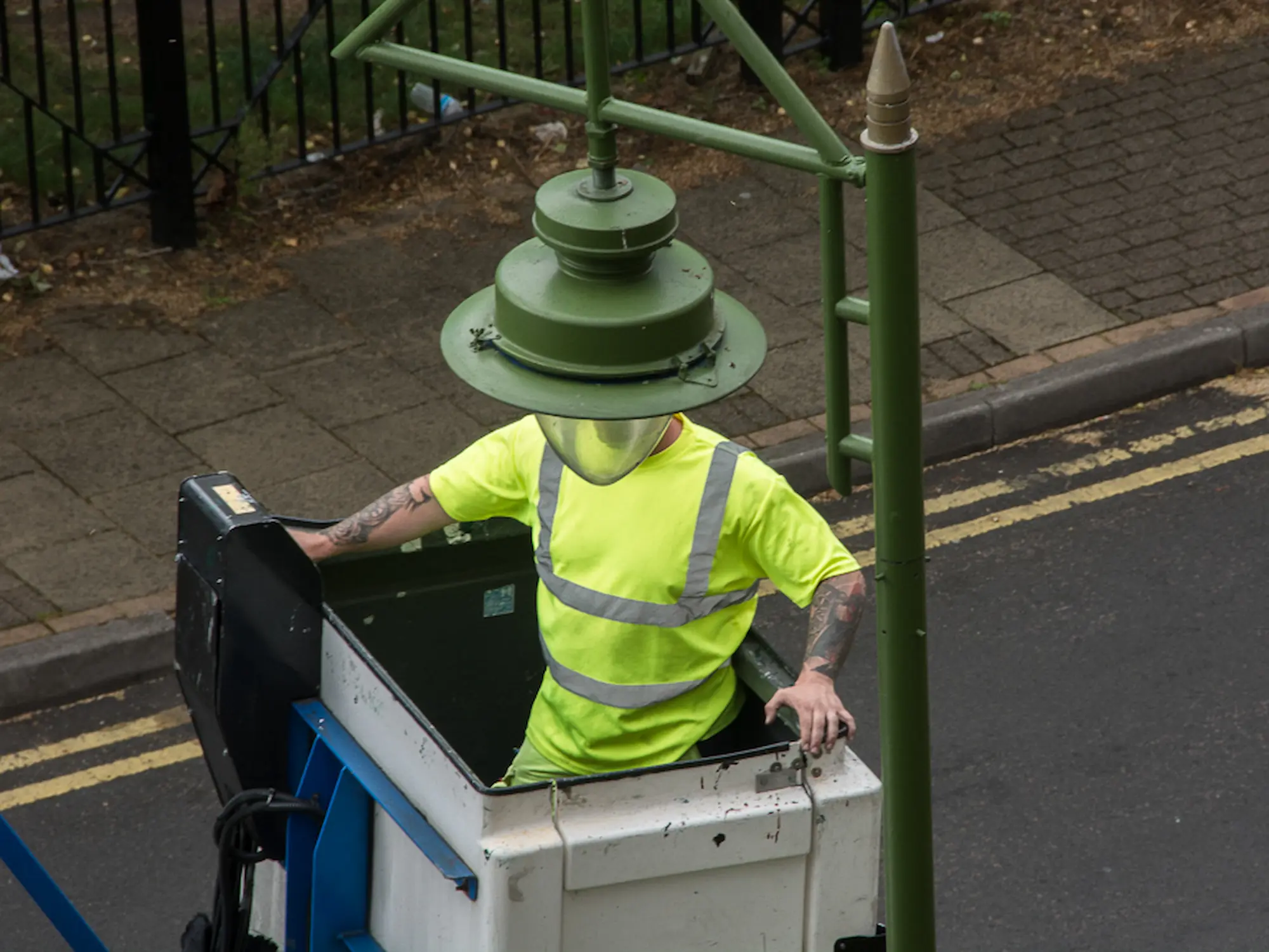 A shopping trolly is falling in the canal