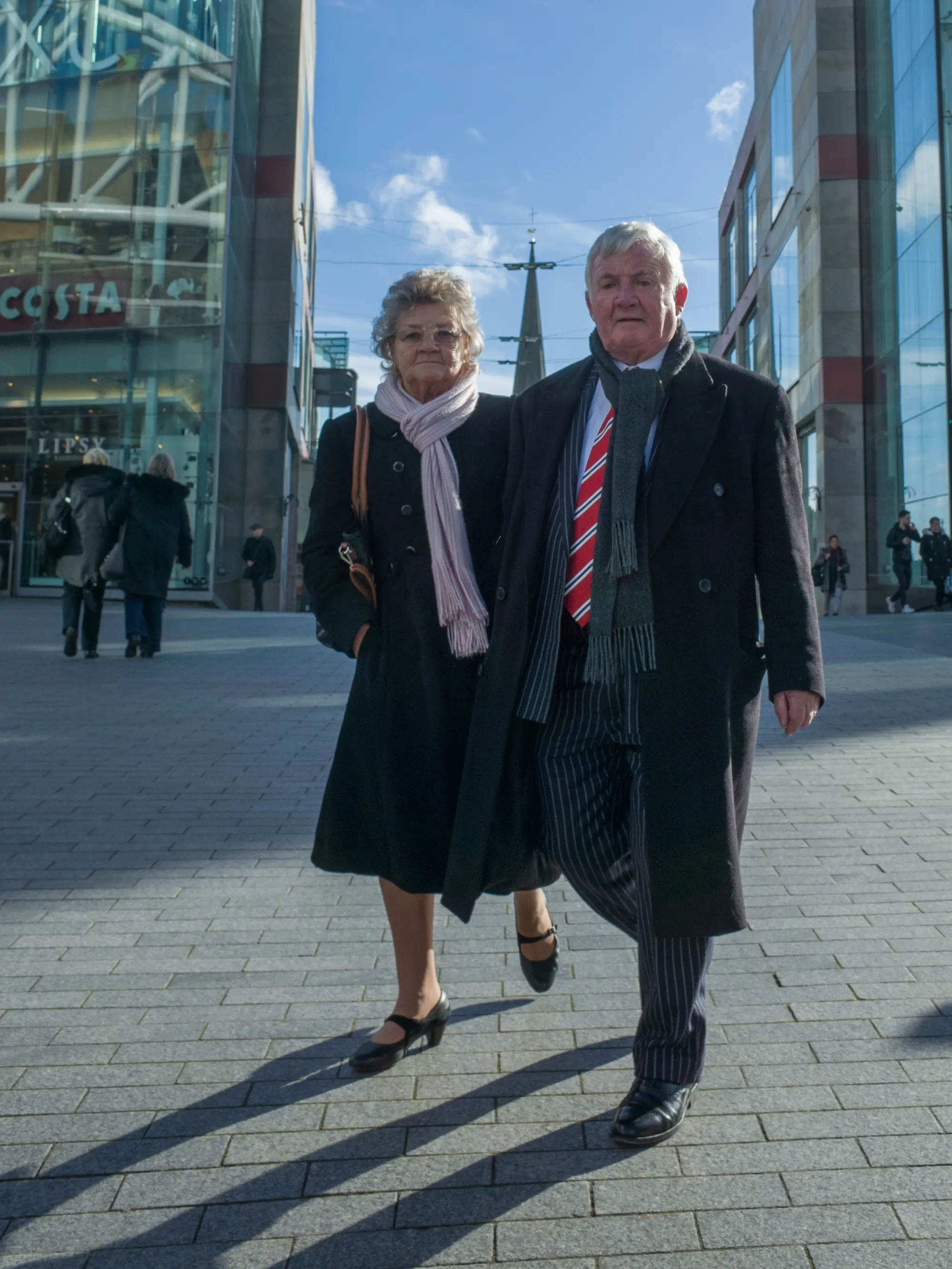 a couple walking in the city center