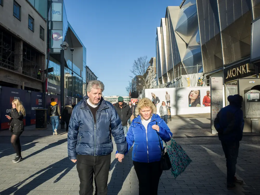 a couple walking in the city center