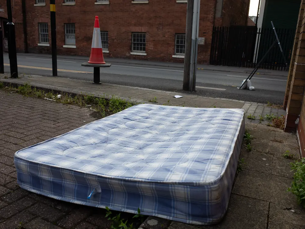 A shopping trolly is falling in the canal