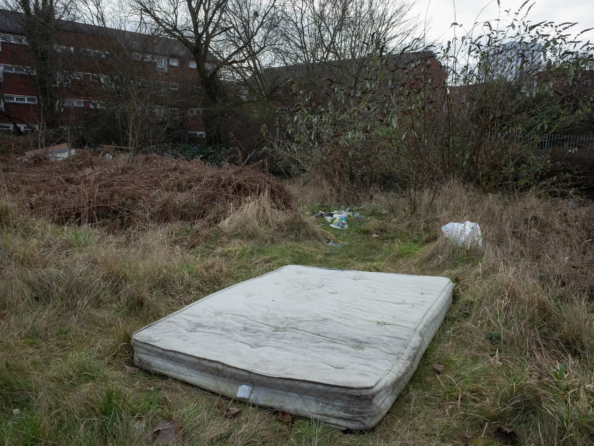 A shopping trolly is falling in the canal