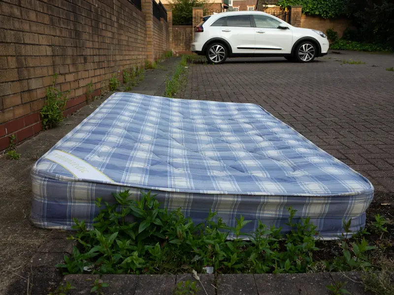 A shopping trolly is falling in the canal